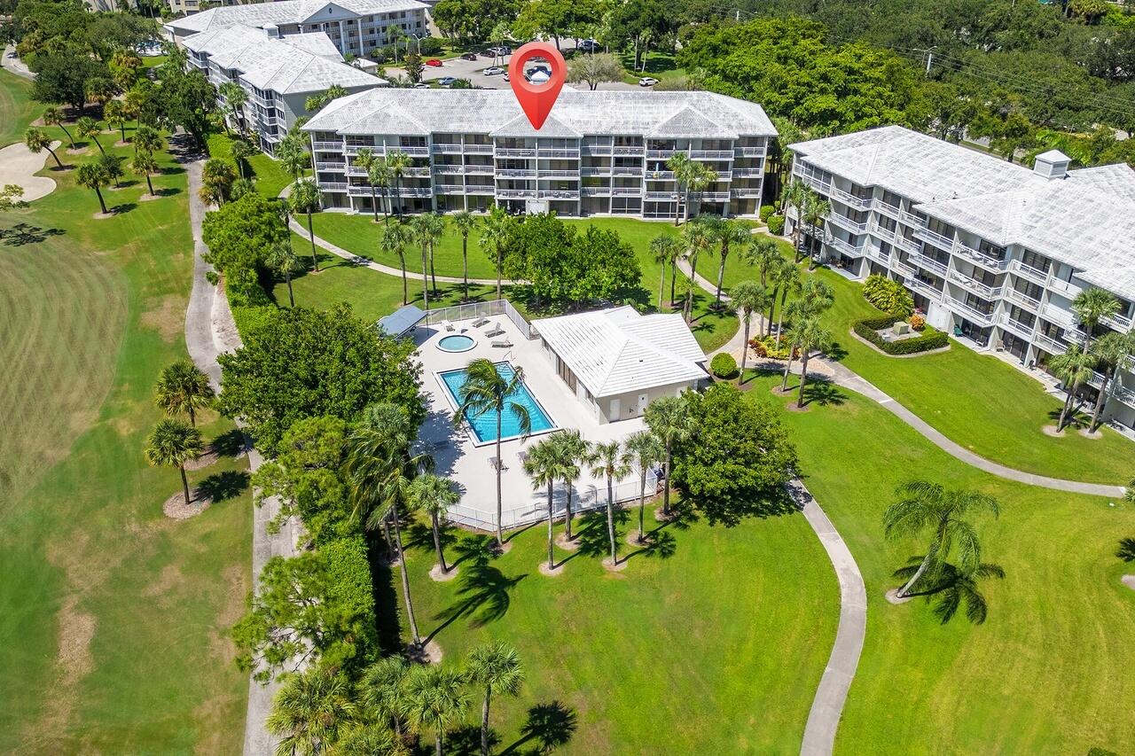 2791 Village Boulevard, Unit 105 West Palm Beach, FL 33409 - Photo 3 of 16 a aerial view of a house with a swimming pool and outdoor seating
