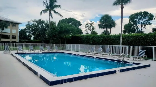 a view of a swimming pool with a chair