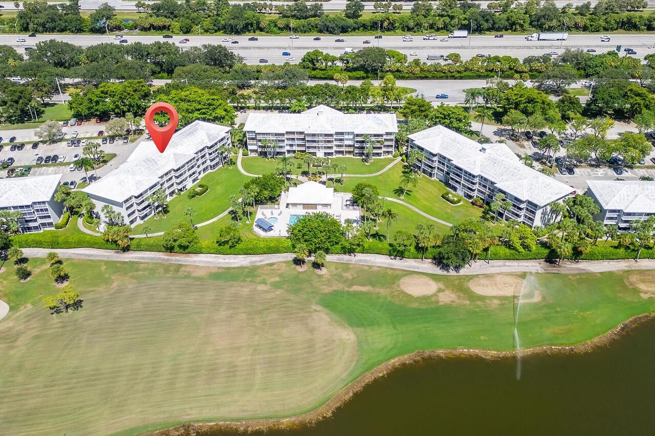 2791 Village Boulevard, Unit 105 West Palm Beach, FL 33409 - Photo 8 of 16 an aerial view of tennis court