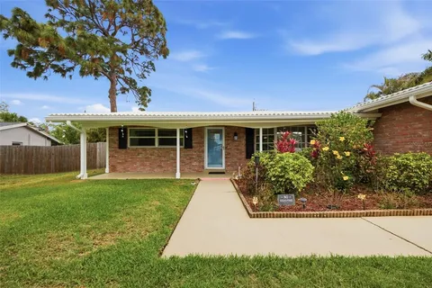 front view of a house with a garden