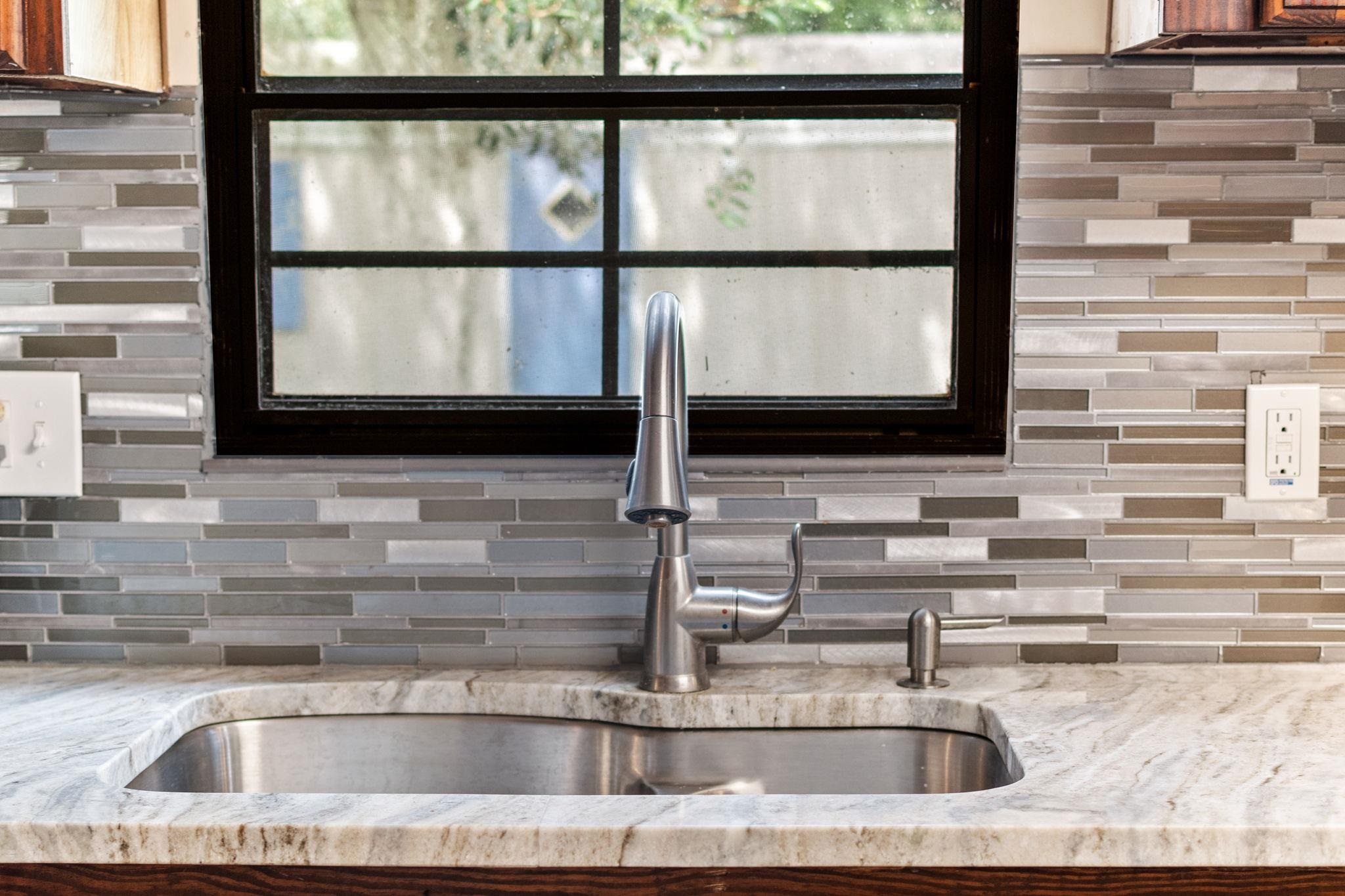 890 Kings Estate Road St. Augustine, FL 32086 - Photo 11 of 38 a kitchen sink sitting next to a window