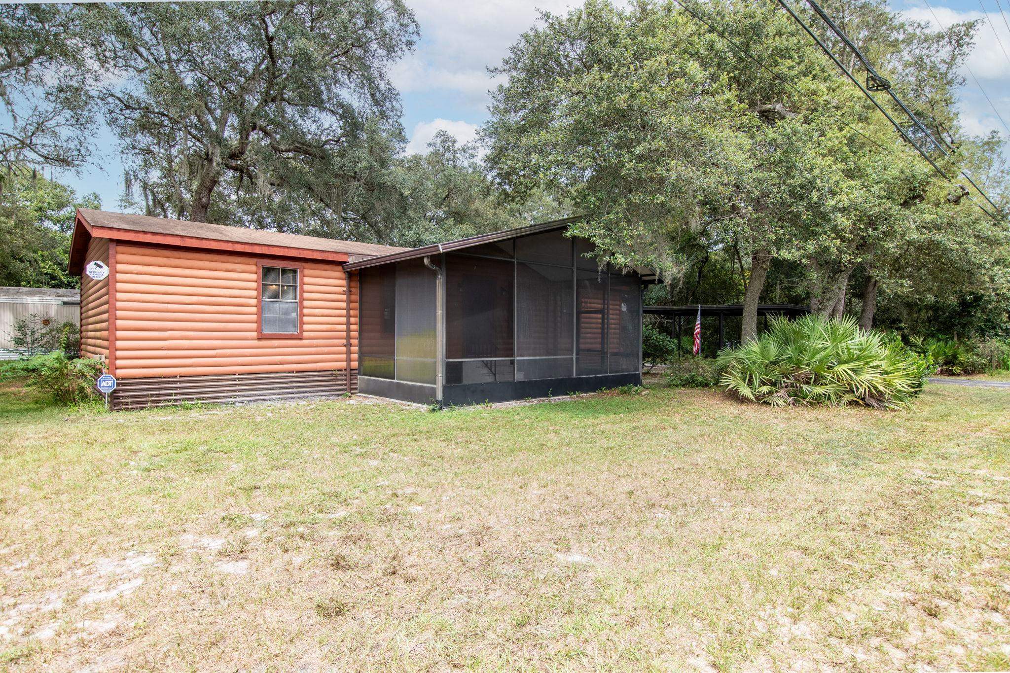 890 Kings Estate Road St. Augustine, FL 32086 - Photo 17 of 38 a house with trees in the background