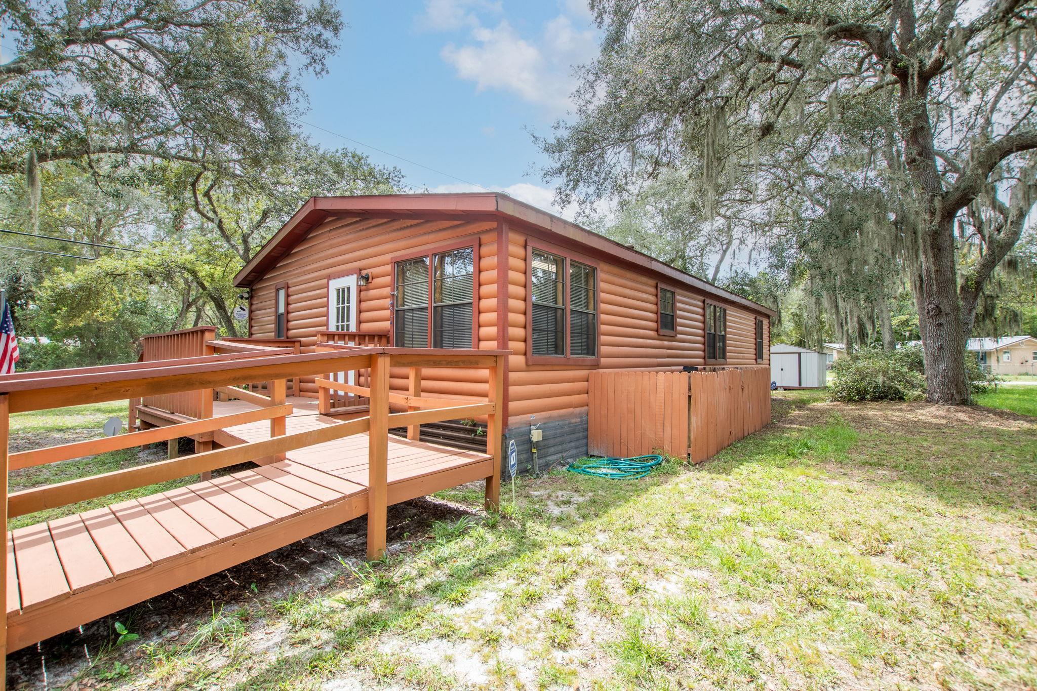 890 Kings Estate Road St. Augustine, FL 32086 - Photo 2 of 38 a view of a house with a yard
