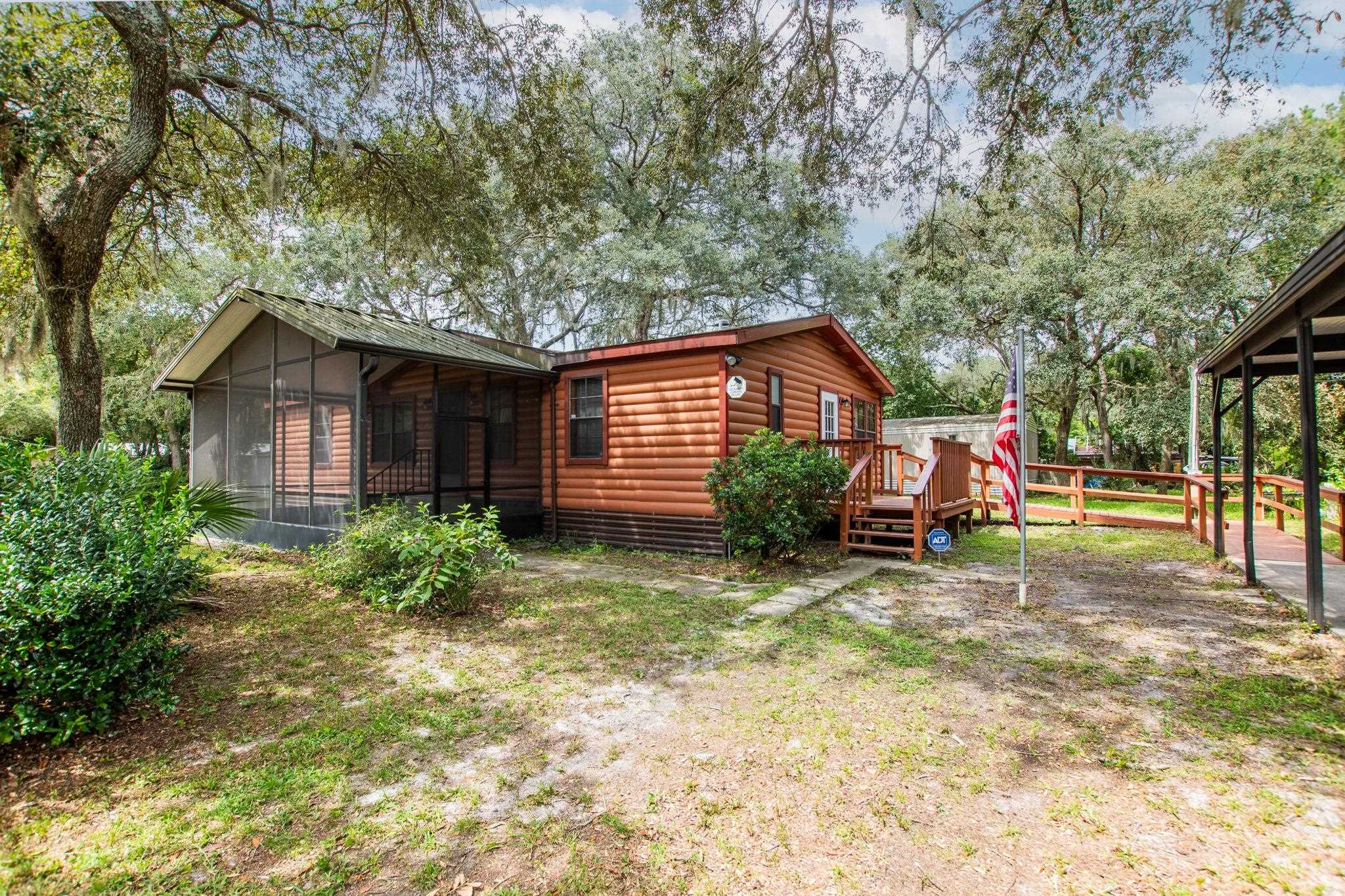 890 Kings Estate Road St. Augustine, FL 32086 - Photo 24 of 38 a view of an house with backyard space and garden