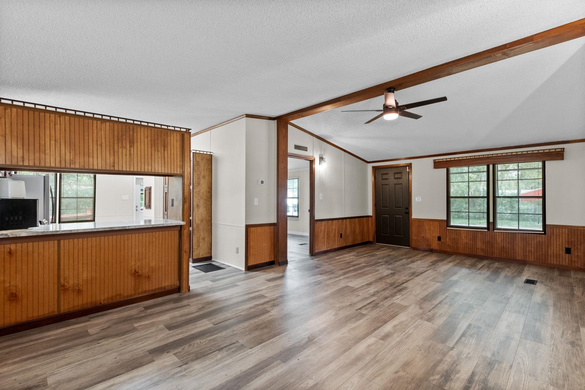 890 Kings Estate Road St. Augustine, FL 32086 - Photo 31 of 38 a view of an empty room with wooden floor and a window