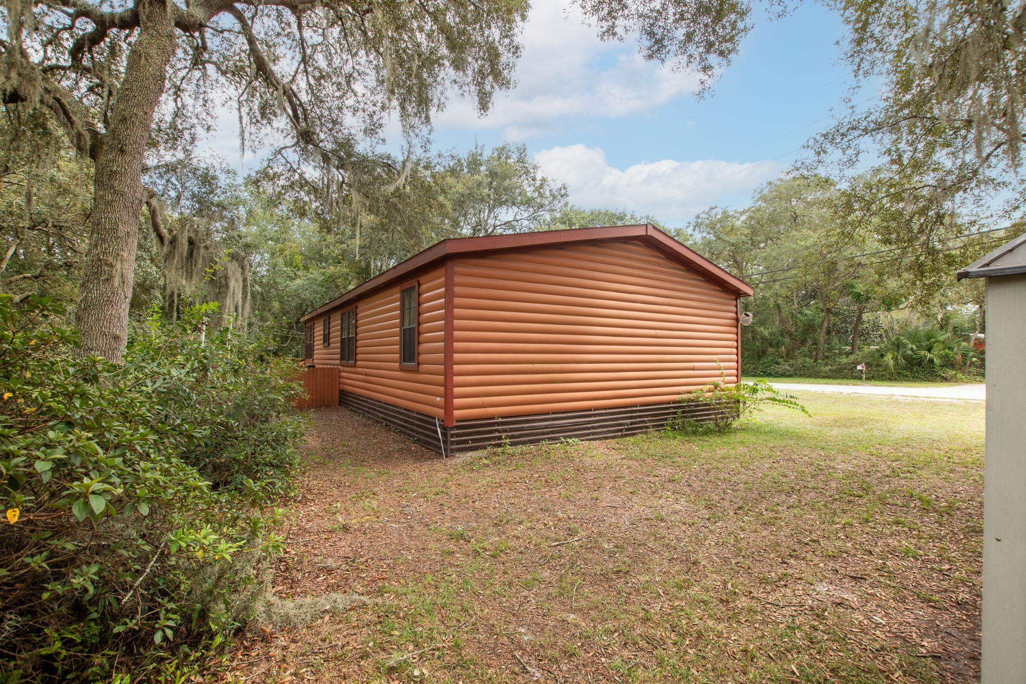 890 Kings Estate Road St. Augustine, FL 32086 - Photo 33 of 38 a backyard of a house with lots of green space
