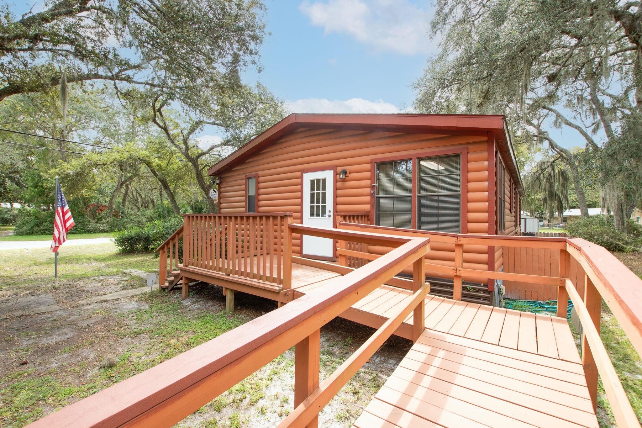 890 Kings Estate Road St. Augustine, FL 32086 - Photo 36 of 38 a view of a house with a wooden deck
