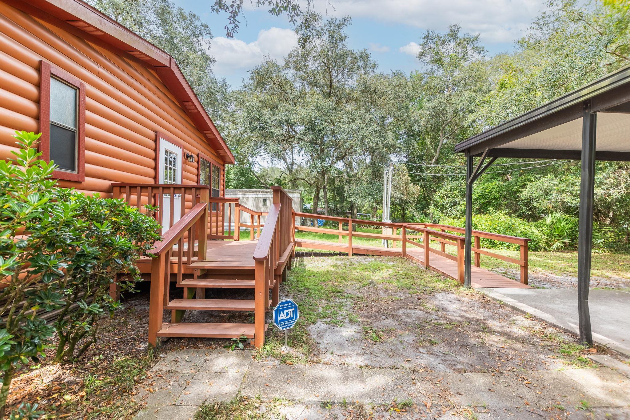 890 Kings Estate Road St. Augustine, FL 32086 - Photo 6 of 38 a view of a deck with a backyard