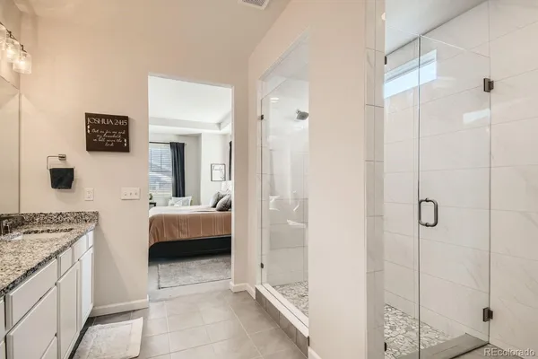 a spacious bathroom with a tub shower and sink
