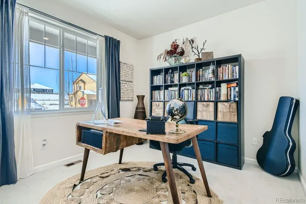 a view of a workspace with furniture