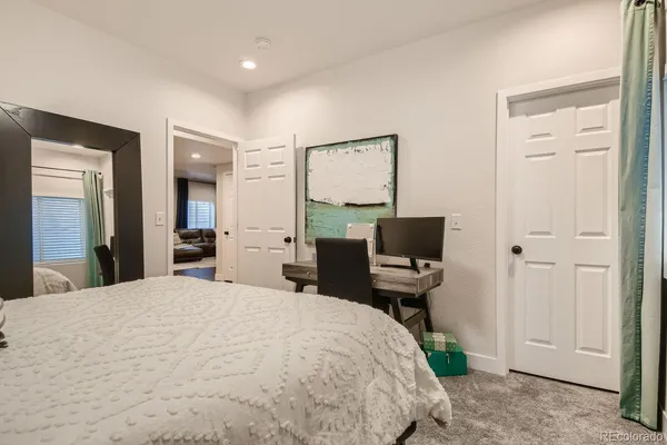 a bedroom with a bed and furniture