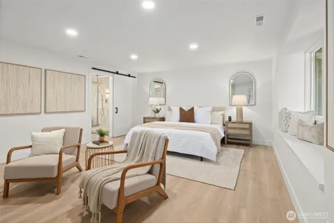 a bedroom with a bed and a couch