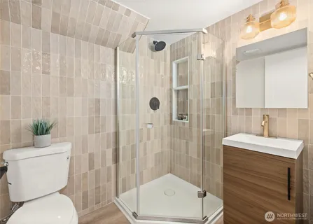 a bathroom with a sink toilet and shower