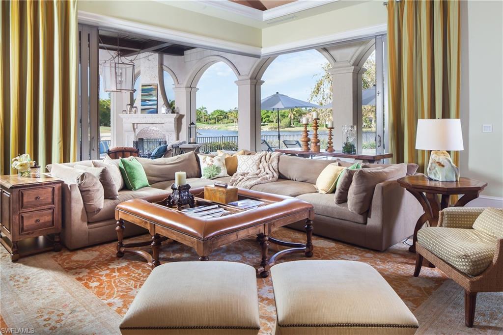 2152 Canna Way Naples, FL 34105 - Photo 12 of 25 a living room with furniture and a large window