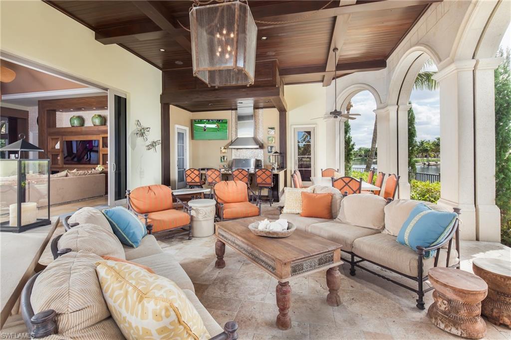 2152 Canna Way Naples, FL 34105 - Photo 13 of 25 a living room with furniture and a large window