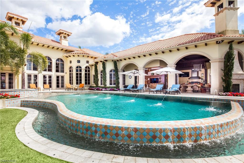 2152 Canna Way Naples, FL 34105 - Photo 18 of 25 a view of a house with a swimming pool