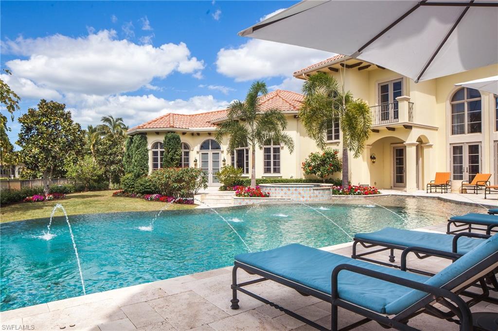2152 Canna Way Naples, FL 34105 - Photo 19 of 25 a view of a house with swimming pool and sitting area