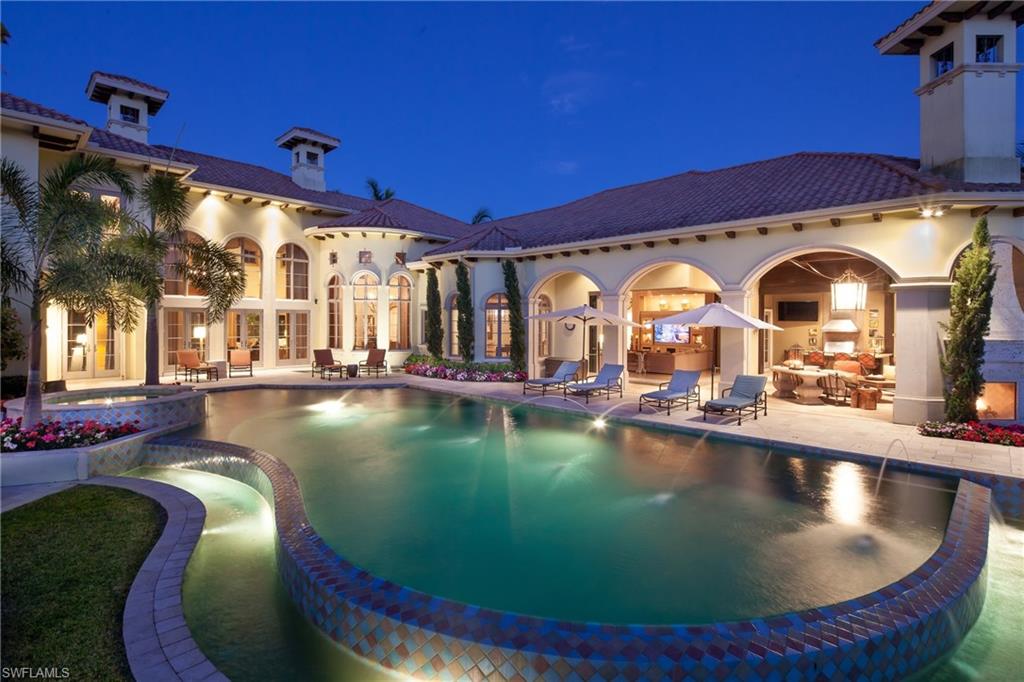 2152 Canna Way Naples, FL 34105 - Photo 2 of 25 a view of a swimming pool with outdoor space