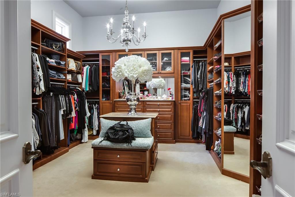 2152 Canna Way Naples, FL 34105 - Photo 24 of 25 a view of a room with lots of clothes and toys