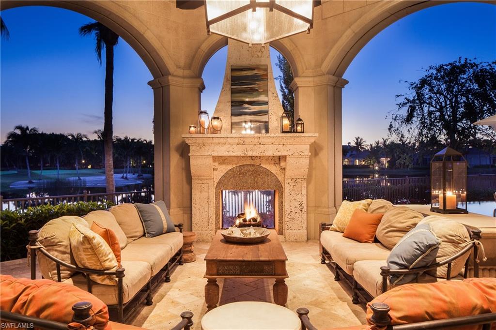 2152 Canna Way Naples, FL 34105 - Photo 3 of 25 a outdoor living space with furniture and a fireplace