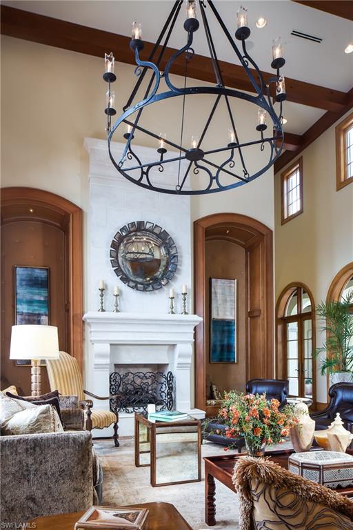 2152 Canna Way Naples, FL 34105 - Photo 7 of 25 a living room with furniture and a fireplace