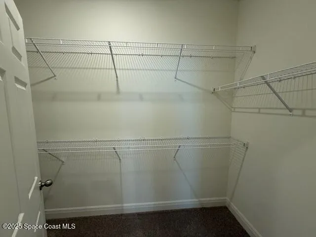 a view of a room with racks on the wall