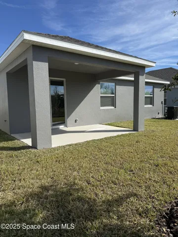a view of backyard of a house