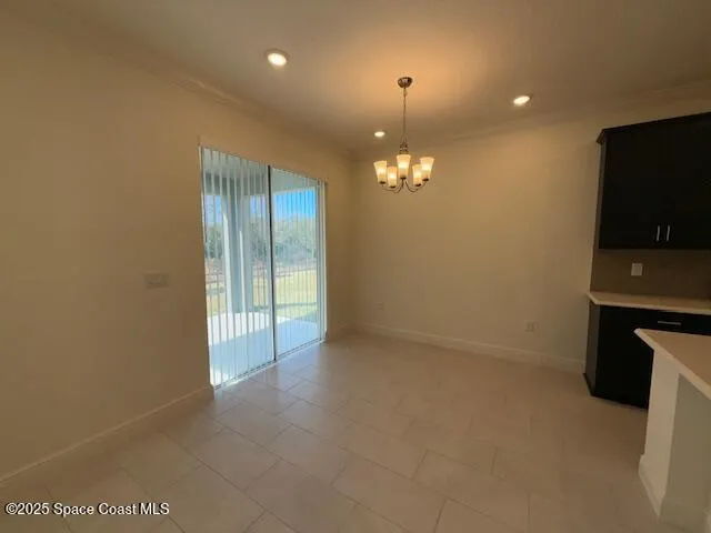 a view of an empty room with a mirror