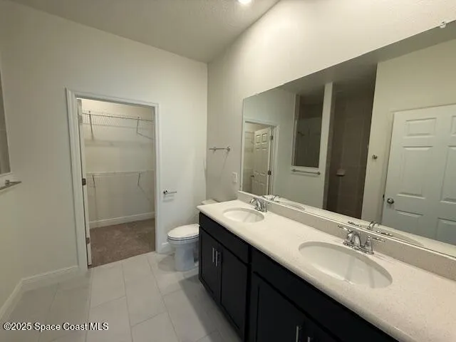 a bathroom with a double vanity sink mirror double and shower
