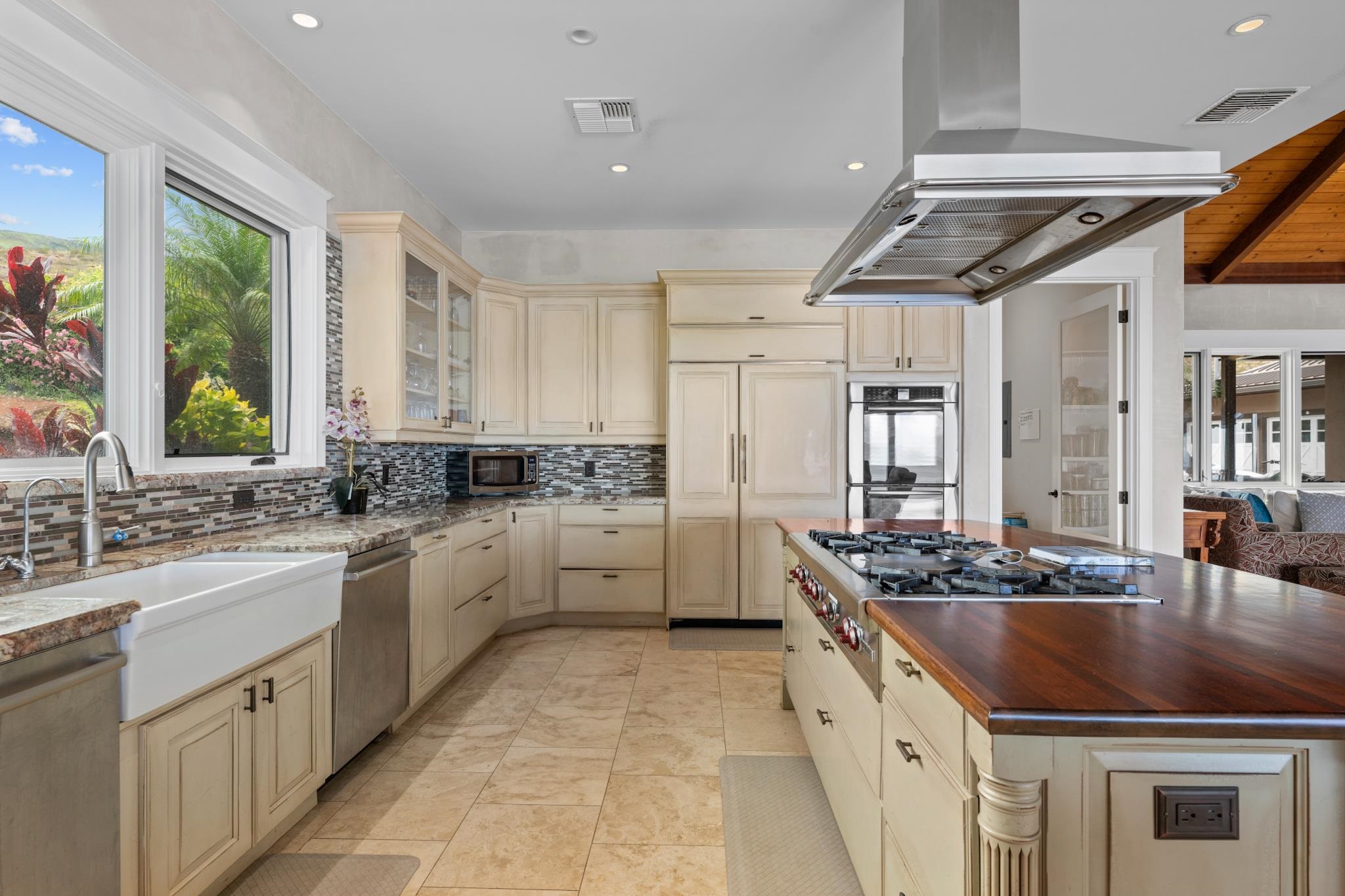 554 Punakea Loop, Unit A Lahaina, HI 96761 - Photo 16 of 49 a kitchen with stainless steel appliances granite countertop a stove a sink and a refrigerator