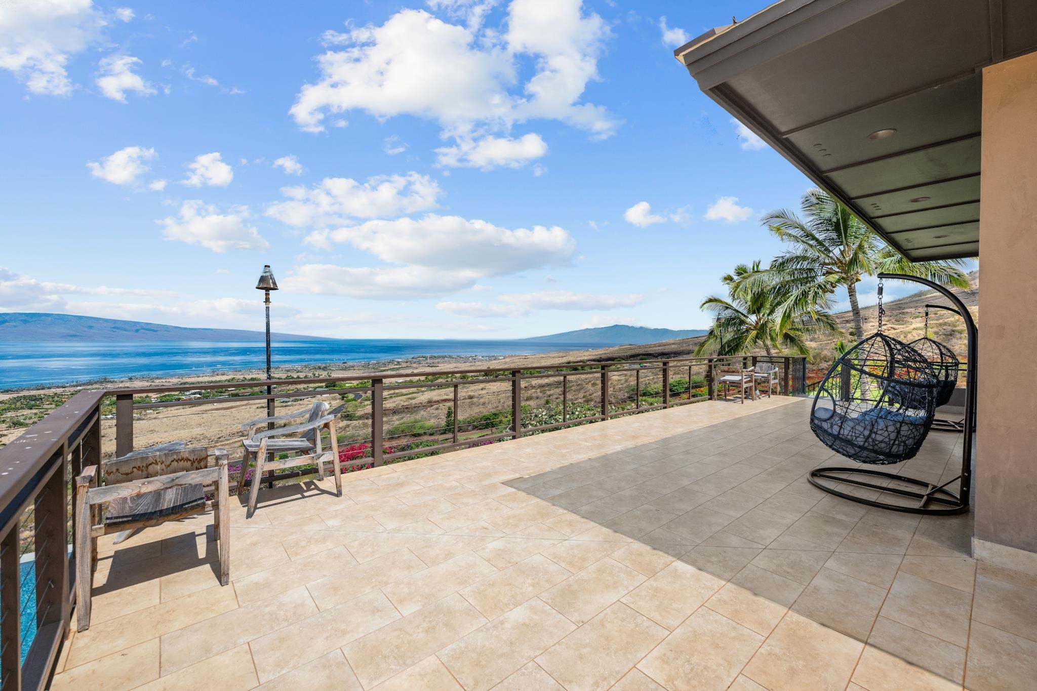 554 Punakea Loop, Unit A Lahaina, HI 96761 - Photo 25 of 49 a view of a chairs and table in the patio