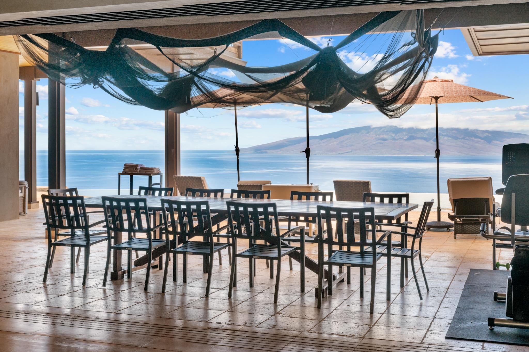 554 Punakea Loop, Unit A Lahaina, HI 96761 - Photo 44 of 49 a view of a chairs and table in the patio