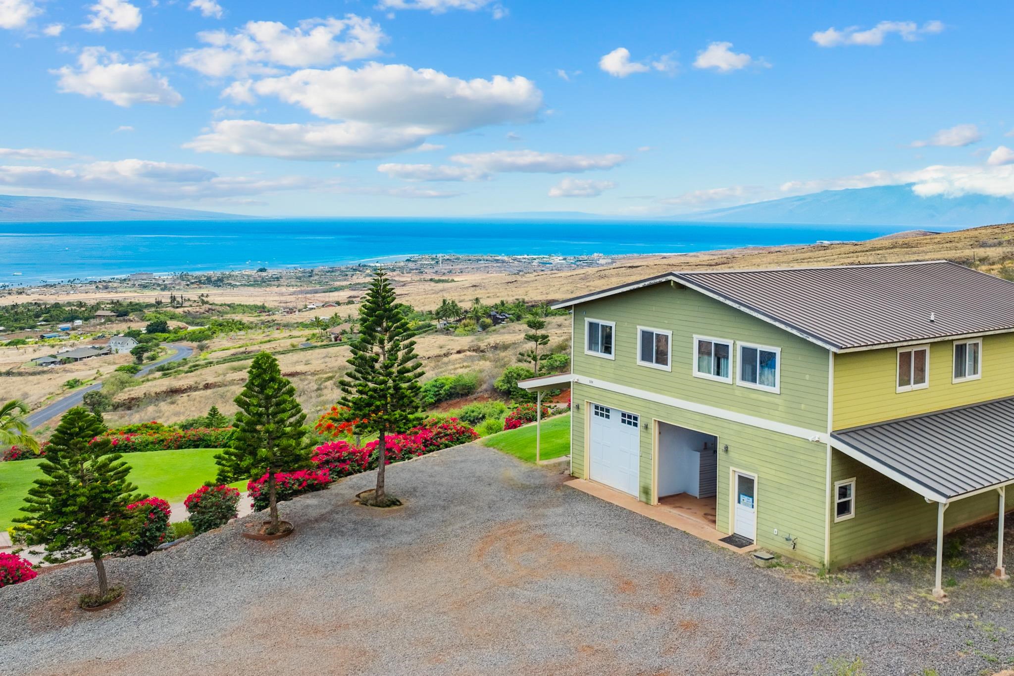 554 Punakea Loop, Unit A Lahaina, HI 96761 - Photo 46 of 49 an aerial view of a house with a garden space