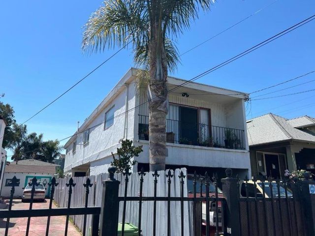 a front view of house and yard with green space