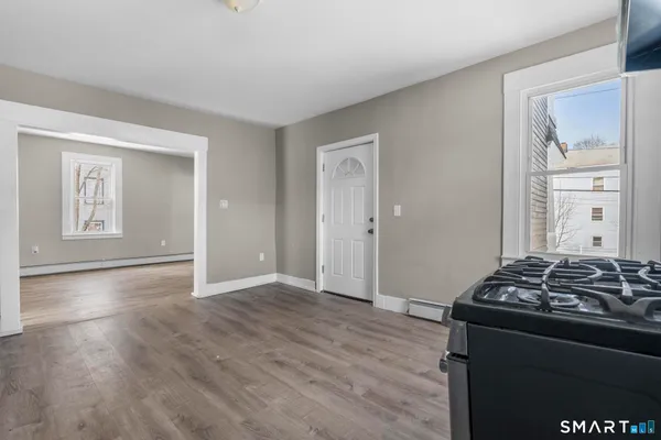 a view of a black and white kitchen with a stove