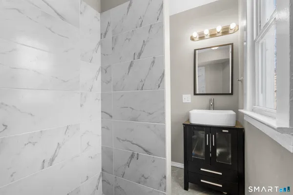 a bathroom with a sink and vanity