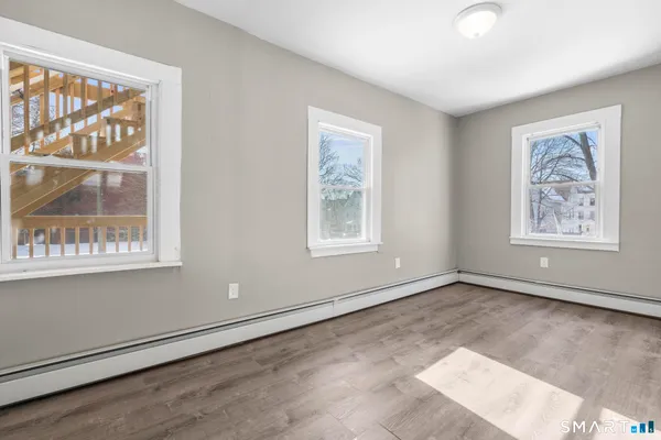 a view of an empty room with a window