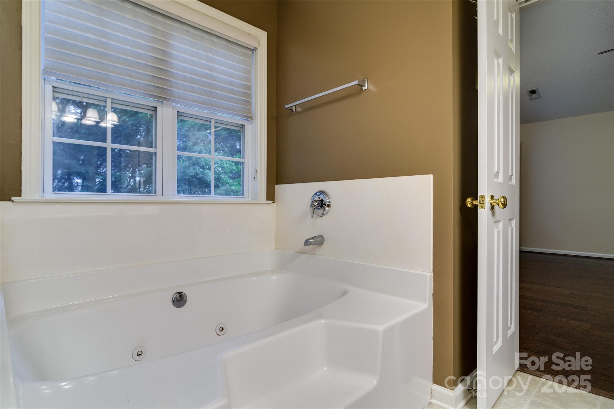 395 Running Briar Road Fletcher, NC 28732 - Photo 20 of 33 a white bath tub sitting next to a white sink and vanity