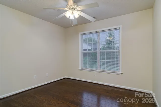 wooden floor in a hall with an empty room
