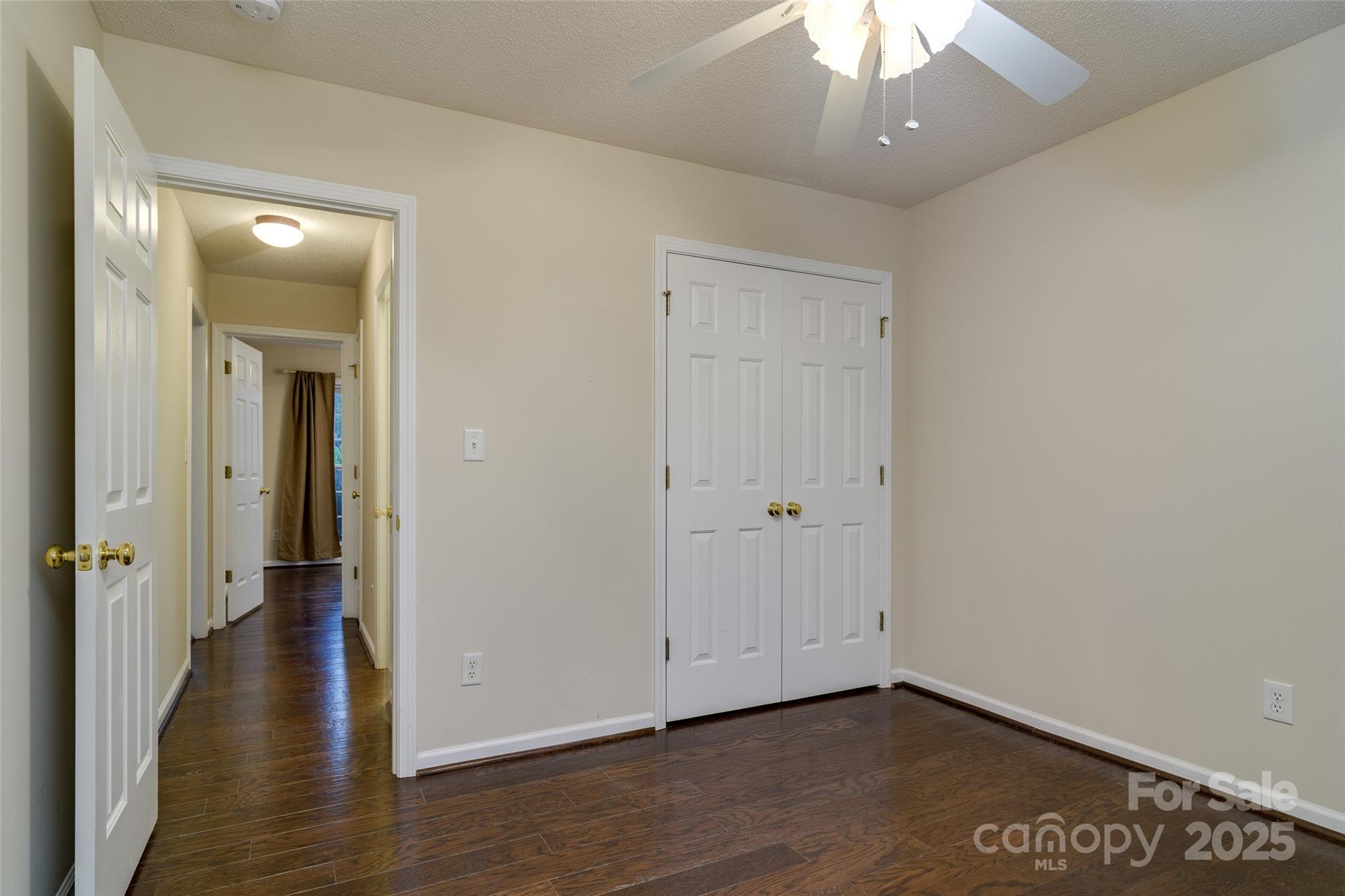 395 Running Briar Road Fletcher, NC 28732 - Photo 26 of 33 wooden floor in a hall with an empty room