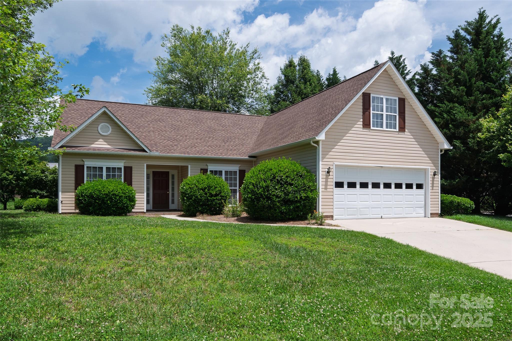 395 Running Briar Road Fletcher, NC 28732 - Photo 30 of 33 a front view of a house with a yard and garage