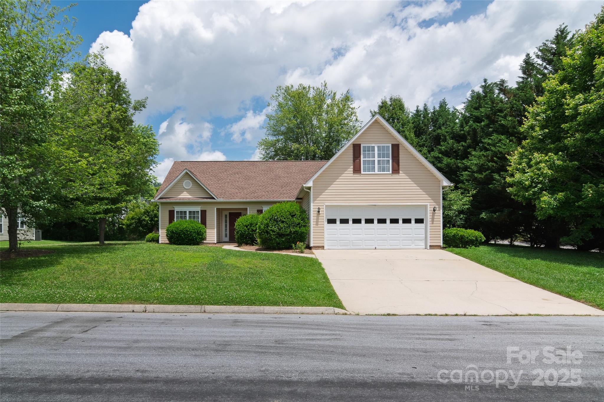 395 Running Briar Road Fletcher, NC 28732 - Photo 3 of 33 a view of a house with a yard and a garden