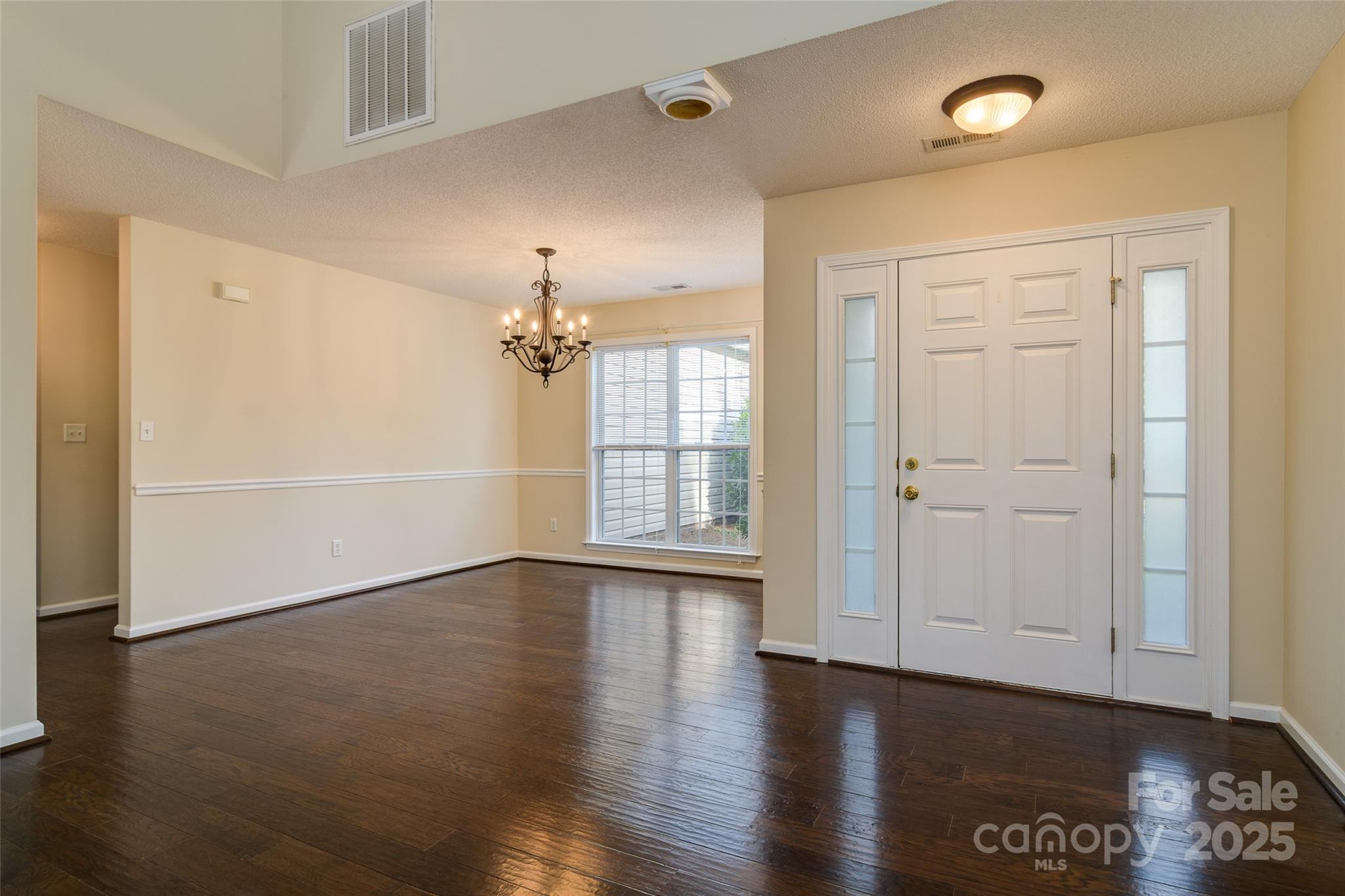 395 Running Briar Road Fletcher, NC 28732 - Photo 6 of 33 wooden floor in an empty room with a window