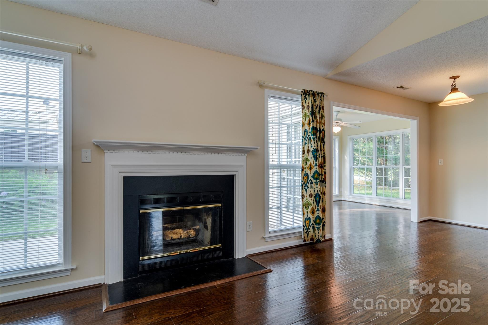 395 Running Briar Road Fletcher, NC 28732 - Photo 8 of 33 a living room with a fireplace with wooden floor