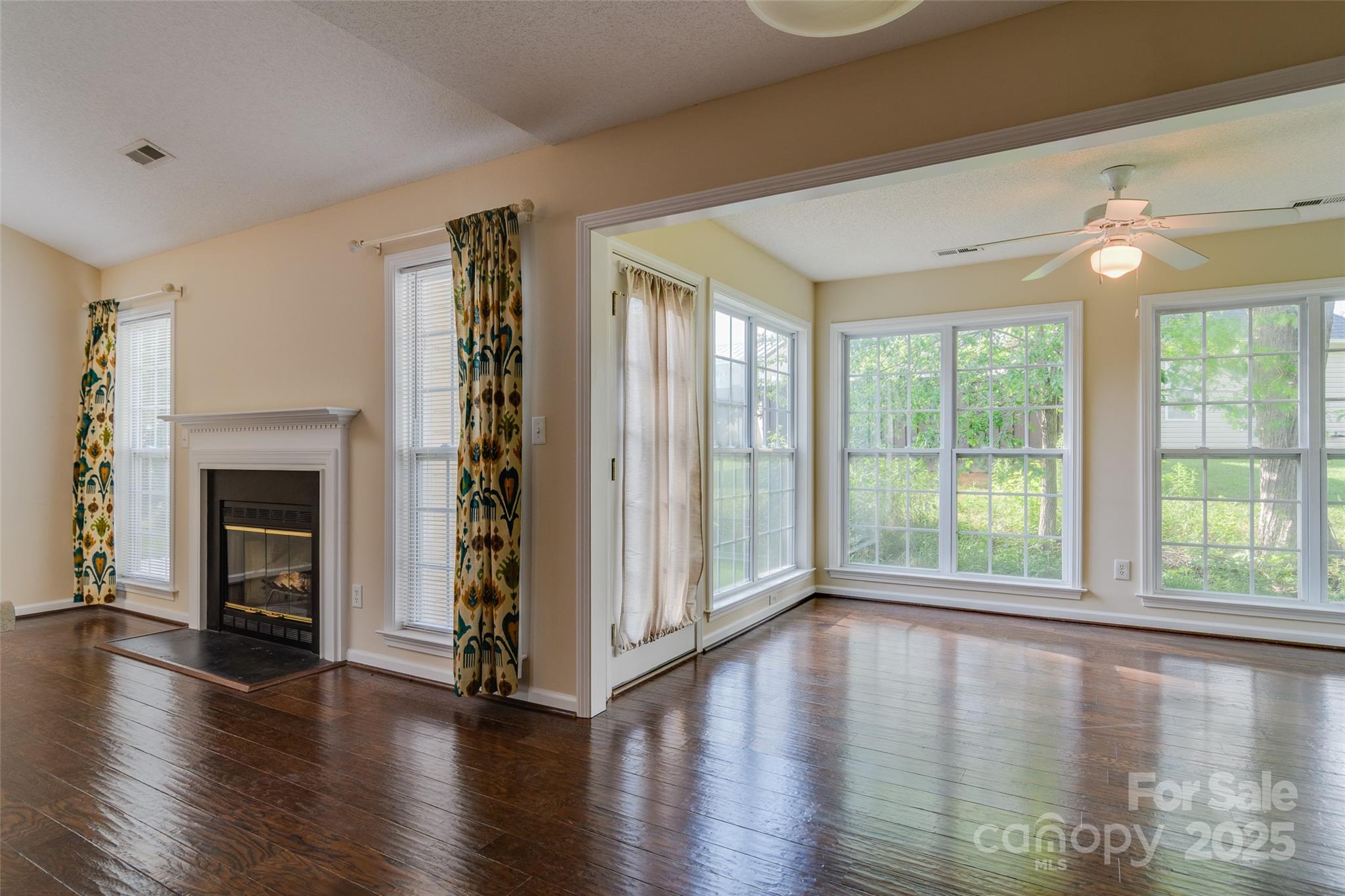 395 Running Briar Road Fletcher, NC 28732 - Photo 9 of 33 a view of an empty room with wooden floor and a window