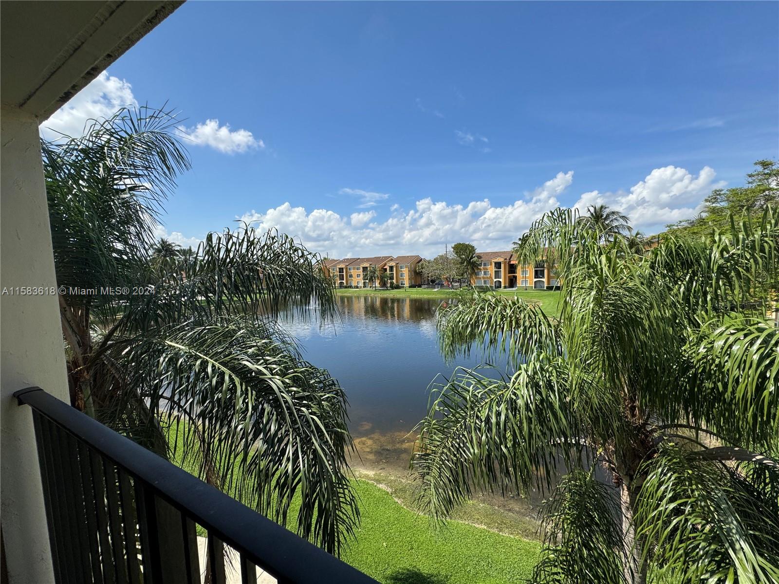 a view of a lake from a balcony