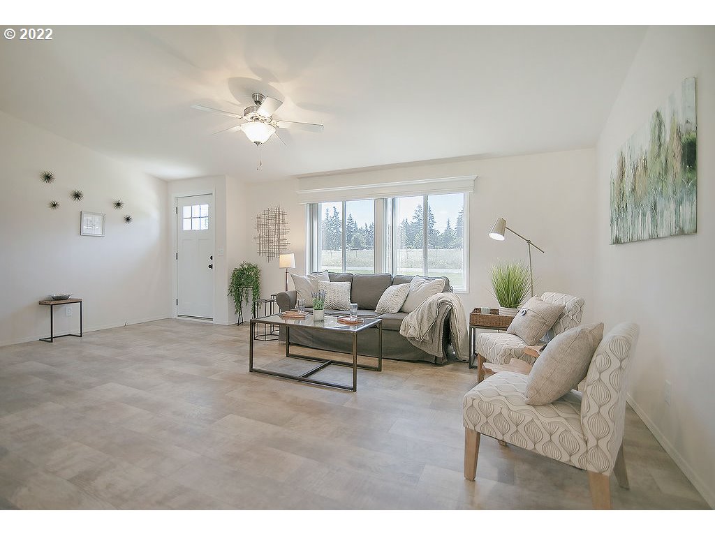 129 Rarey Road Winlock, WA 98596 - Photo 5 of 32 a living room with furniture and a large window