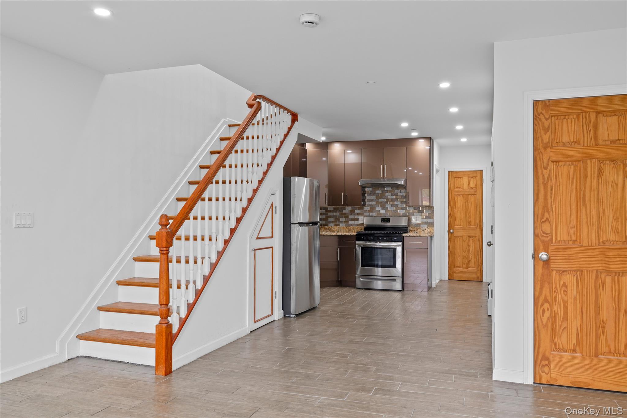168-31 Hillside Avenue, Unit F Queens, NY 11432 - Photo 6 of 16 a view of kitchen with sink and refrigerator