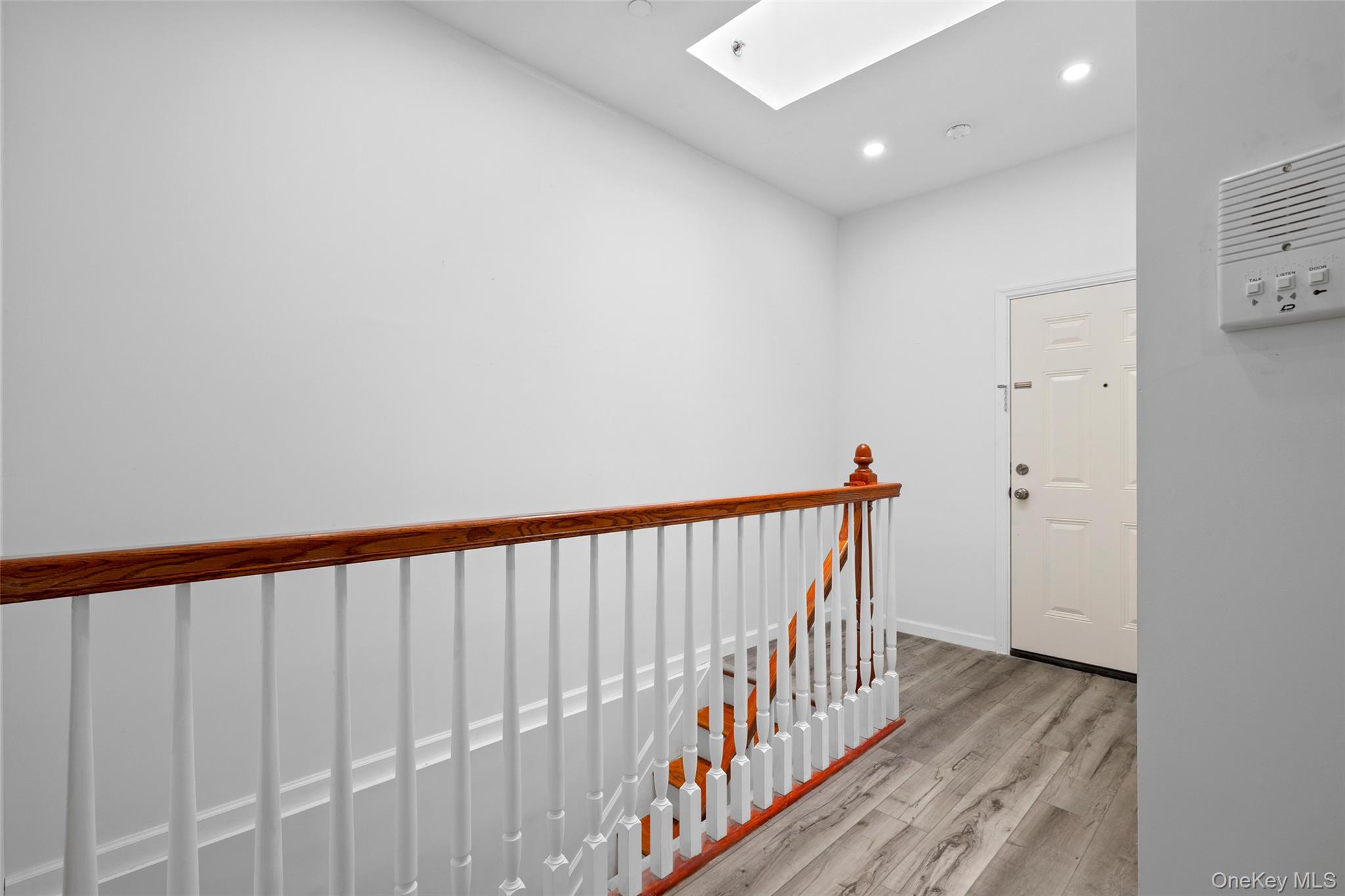 168-31 Hillside Avenue, Unit F Queens, NY 11432 - Photo 9 of 16 a view of hallway with wooden floor