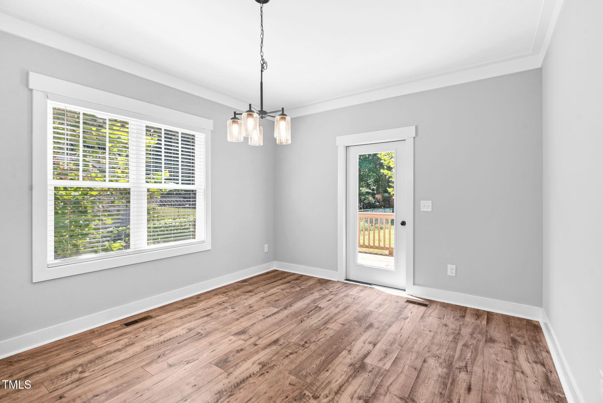 1004 Snow Peak Court Raleigh, NC 27603 - Photo 28 of 65 a view of empty room with wooden floor and fan